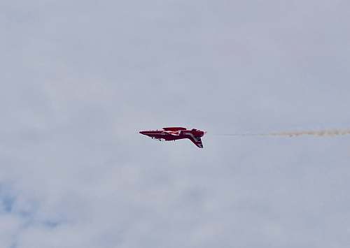 leisure activities red airplane flying under cloudy sky during daytime animal